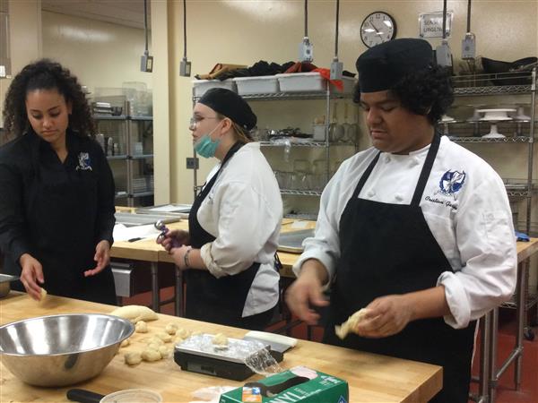 Student making fresh bread